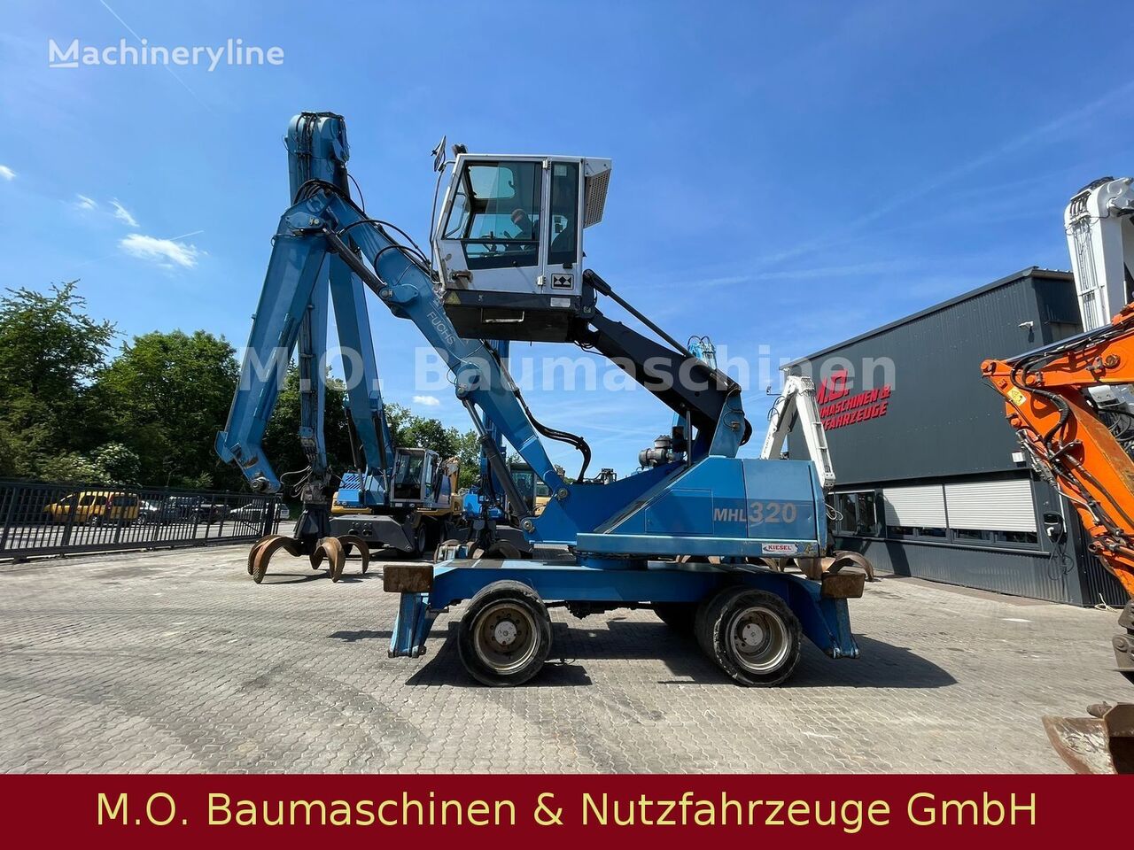 Fuchs MHL 320/ZSA/Hochfahrbare Kabine/Magnetanlage material handler